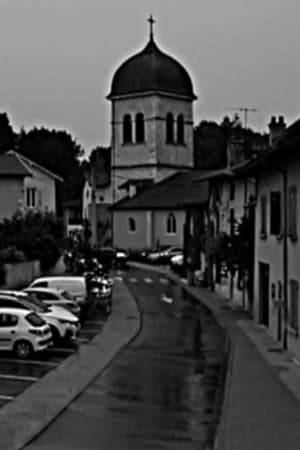 "Villagium" is a film made from a stationary one-and-a-half-hour shot, which shows the storm and the rain in the street, by the church in the village of Priay, Ain.