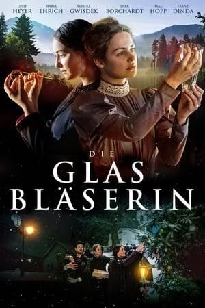 Marie violates tradition in a small German town of Lauscha, to become the first female glassblower in in 1890. Her glass ball decorations find a new market in America.