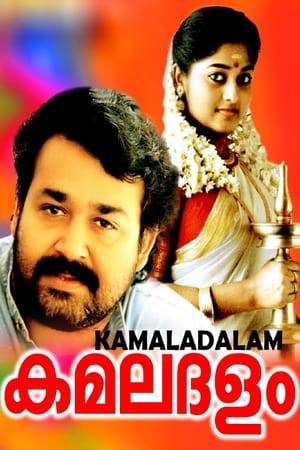 Nandagopan (Mohanlal) is a respected dance teacher at the Kerala Kala Mandiram (alluding to the famed Kerala Kalamandalam repertory which performs Kerala's temple arts). However, his wife Sumangala (Parvathi) commits suicide, causing him to turn into an alcoholic and a compulsive rule breaker. He is suspected of having killed his wife and is suspended from his job for drunken misbehaviour. The new secretary of the institute Velayudhan (Nedumudi Venu) wants him to be sacked but his former reputation gives him a reprieve. He trains the talented student Malavika (Monisha) to perform in his ambitious composition of the Sita Kalyanam, but her jealous young lover Soman (Vineeth) poisons him.