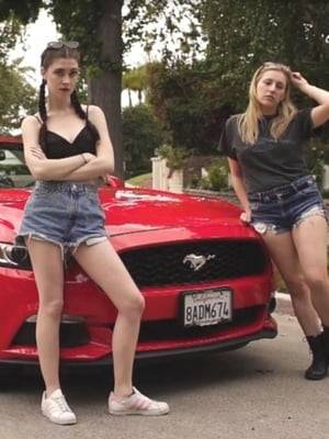 Three girls drive around Hollywood without paying much attention to the road.