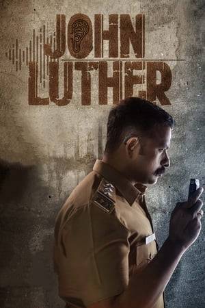Devikulam Police Station SI John Luther is a committed police officer, who even risks his life for policing. During an interrogation, he suffers ruptured eardrums and hearing loss. Will he be able to complete an investigation which he had to leave halfway?