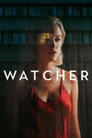 As a serial killer stalks the city, Julia — a young actress who just moved to town with her husband — notices a mysterious stranger watching her from across the street.