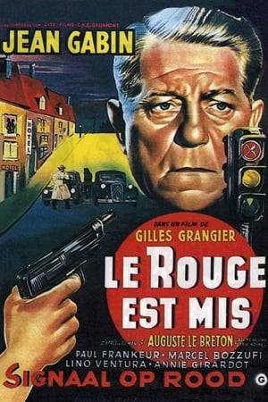 Louis Bertain is the owner of a Paris garage which is the front for a robbery gang. He and his accomplices are careful to keep up a civic veneer by day, indulging in criminal activities only when "the red light is on" at night. This status quo is upset when one of the gang members becomes convinced that Louis' younger brother is a police informer.