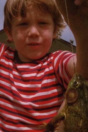 A little boy celebrates his frog catch.