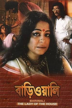 A quiet drama about a lonely, sad, middle-aged woman, Banalata, who has lived a solitary existence since her husband-to-be died the night before their wedding from a snake bite. Never having quite gotten over the tragedy, she rarely ventures out and is clearly very lonely. This changes when she agrees to allow a film production to shoot in a wing in her sprawling estate.