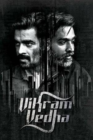 A notorious gangster Vedha surrenders himself to encounter specialist Vikram whom he challenges every step of the way by narrating his life events in the form of riddles that needs to be solved in order to capture him.