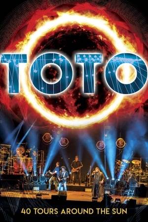 2018 was a banner year and the 40th Anniversary for TOTO who celebrated the occasion by embarking on their longest world tour in years.  The band performed for hundreds of thousands of fans across Europe and North America, as their level of global critical mass reached new heights largely fueled by a rediscovery of favorites from their beloved repertoire. This live performance was filmed in front of a sold-out crowd exceeding 18,000 fans on March 17, 2018 at the Ziggo Dome in Amsterdam. TOTO performed a wide range of songs, including hit singles, rarely performed live deep cuts, and two recently recorded tracks which appeared on their new Greatest Hits album (40 Trips Around The Sun).